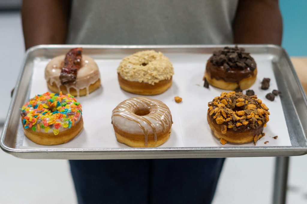 Dough Boy Donuts tray: Sriracha Maple Bacon, Cheesecake, Chocolate, Bam Bam, Cinnabun, and Butterfingers
