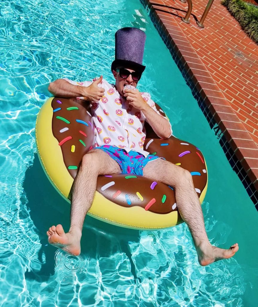 Ilya, The Duke of Donuts, on a donut pool float