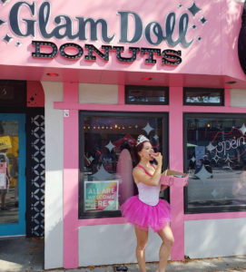 Erin Good in front of Glam Doll donuts (Minneapolis, MN)